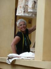 A woman leaning on a balcony