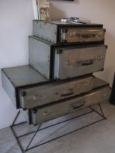 A chest of drawers made of suitcases