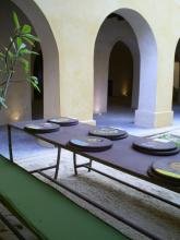 An outside table, with wooden discs on it