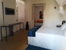 A side view of the Aminou room, pointing toward to door.