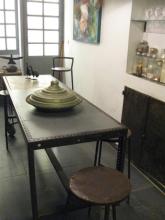 A long table with stools around it