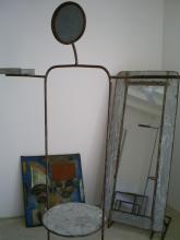 A sculpture, a mirror and a painting
